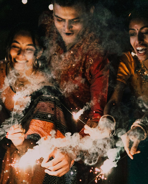 A family celebrating Diwali with sparklers