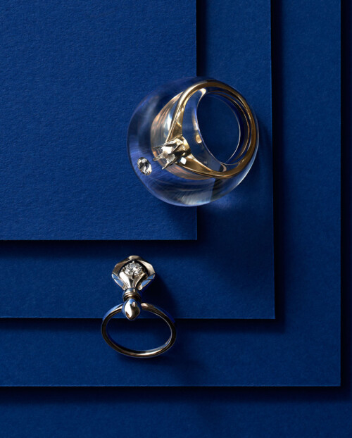 two diamond rings on a blue background