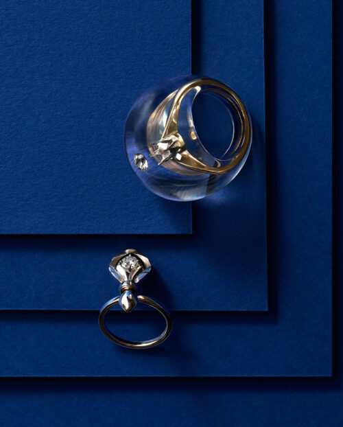 two diamond rings on a blue background